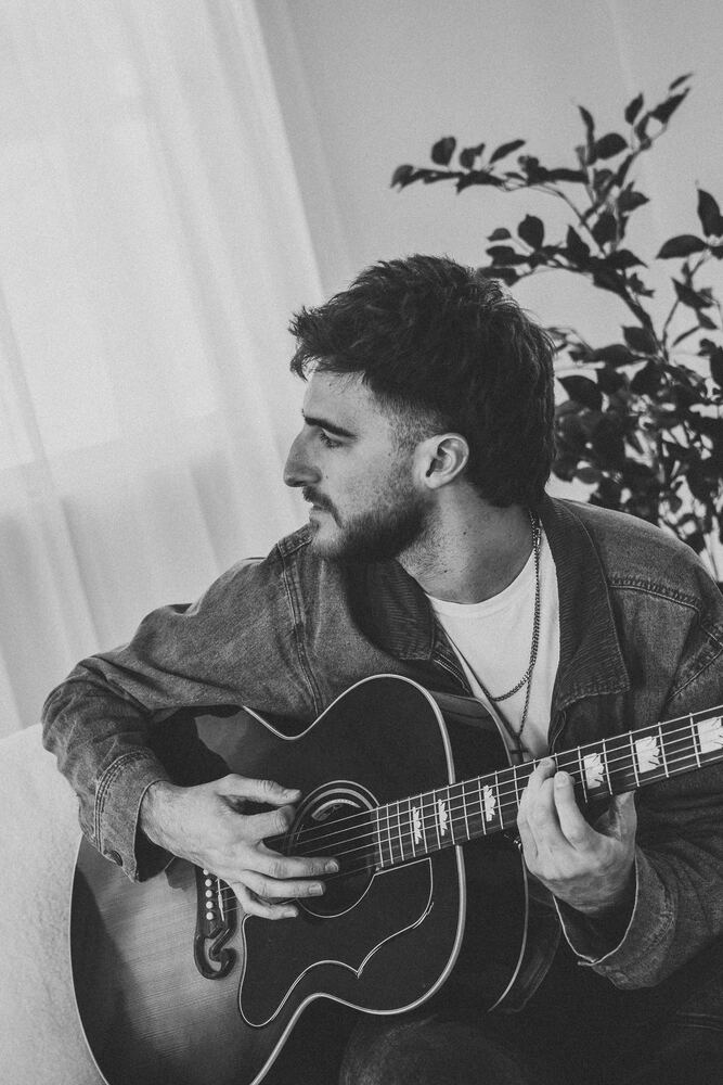 Chandler Letner black and white portrait with guitar